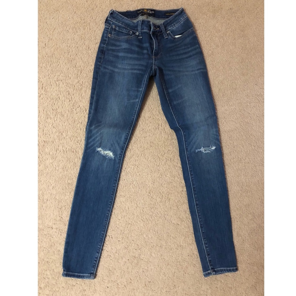 Lucky brand 0/25 skinny jeans with holes on knee